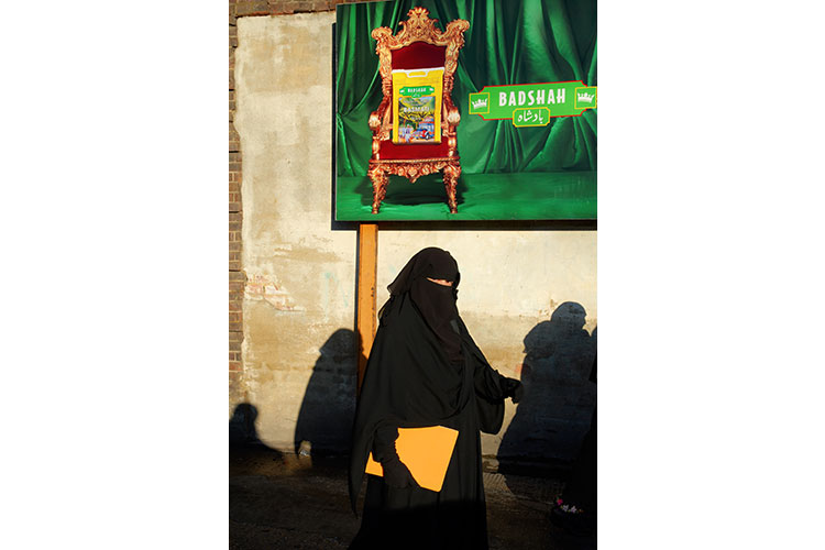 Muslim woman leaving a mosque after friday prayers